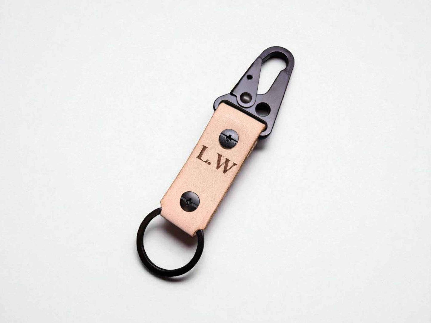 A Tan Customised Tactical Leather Keychain displayed on a white tabletop