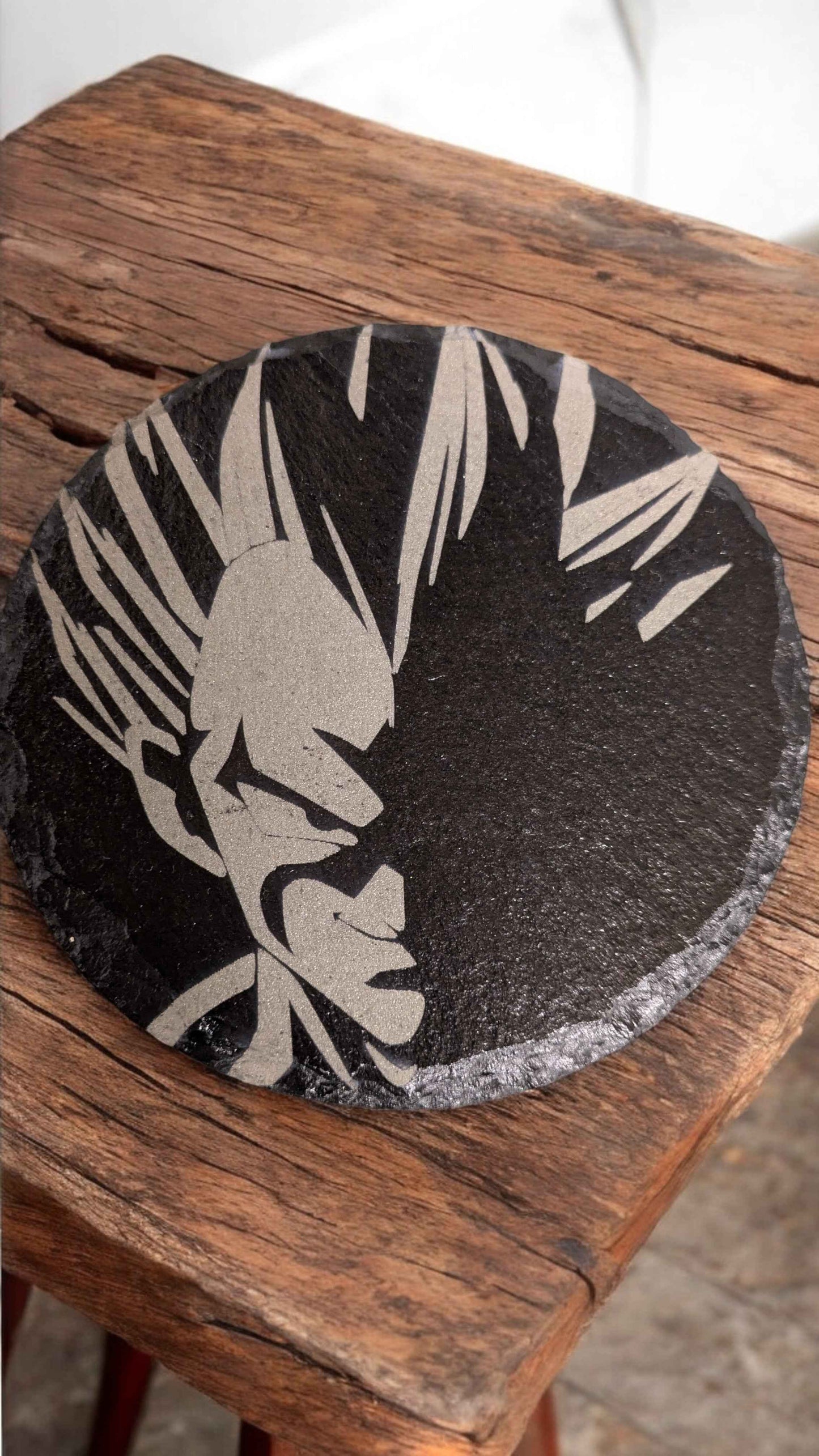Vegetta Dragonball Z Slate Coasters displayed on an oak table.