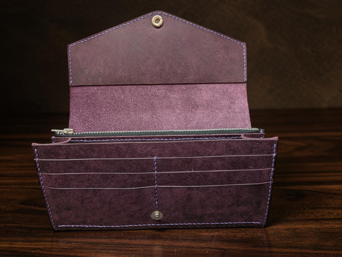 Ladies long wallet in purple Badalassi Pueblo leather fully open showing card slots, zip pouch and note section