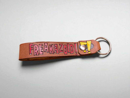 A Freakazoid themed Handmade Leather Keychain displayed against a white backdrop.