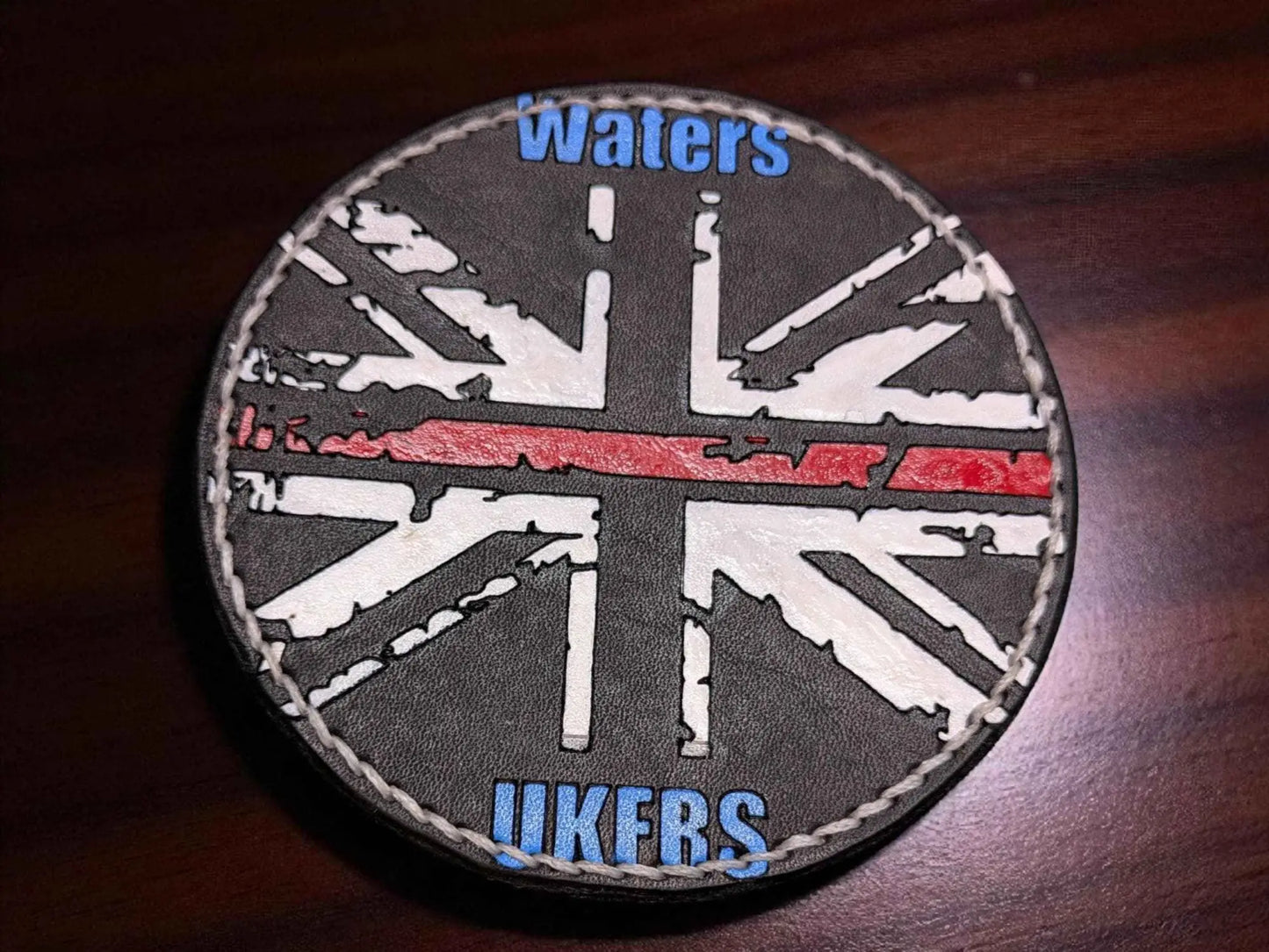 A closed up image of a Bespoke Fire Service Velcro Shoulder Badges displaying the union jack.