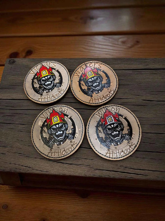 A set of Bespoke Fire Service Velcro Shoulder Badges displayed on a dark brown Worktop.