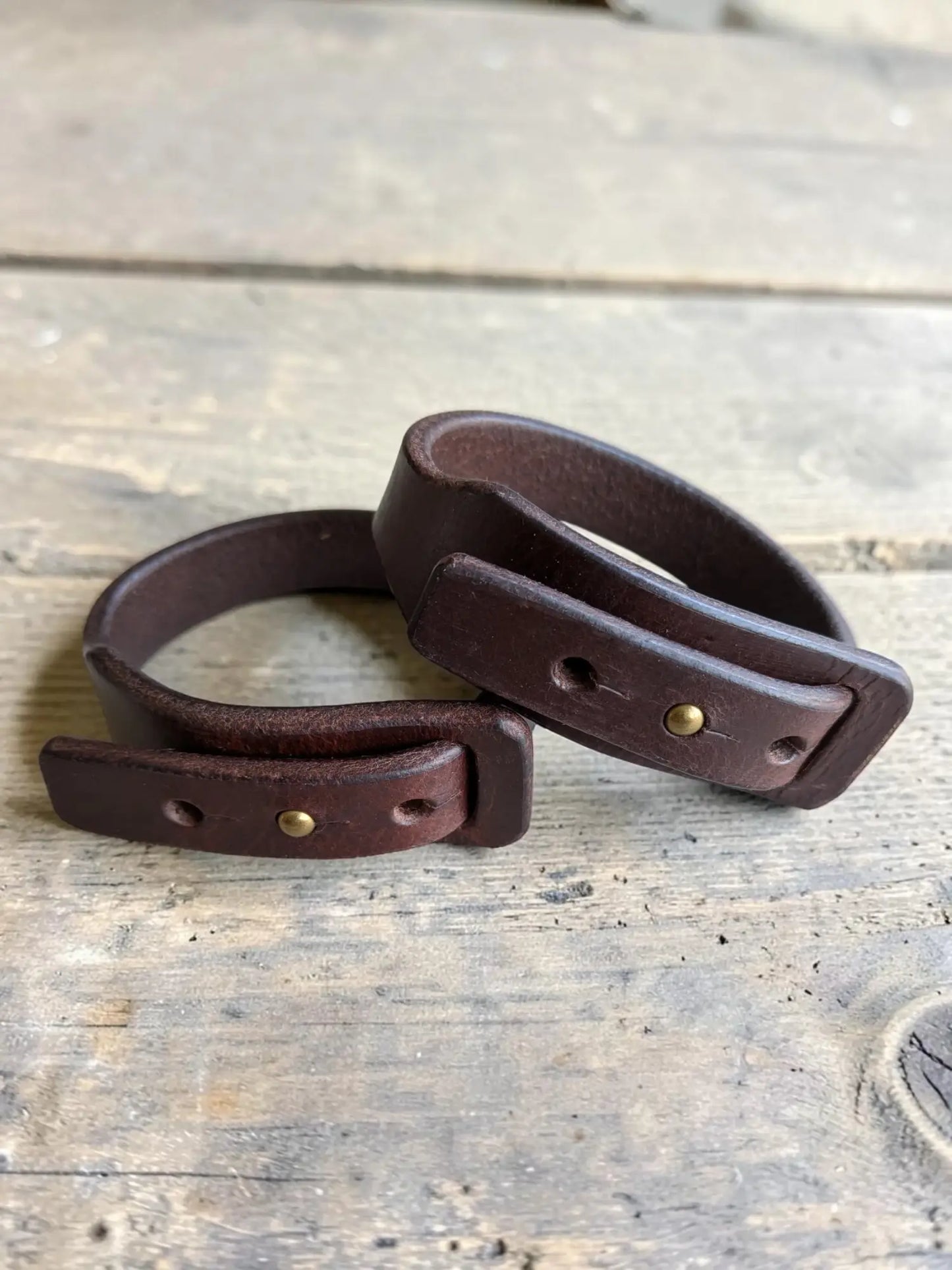 Dark brown full grain leather wrap bracelet with brass buckle hardware for stylish wrist wear