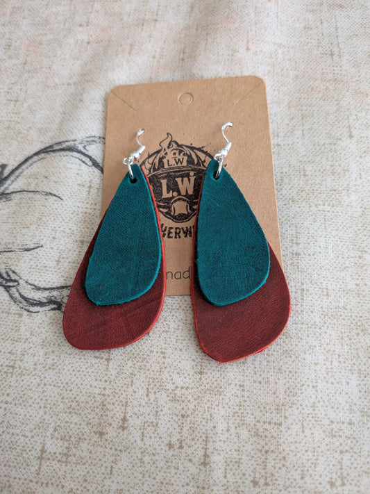 Teal and rust-colored layered leather earrings with silver hooks made from orange oregano leather for stylish wear