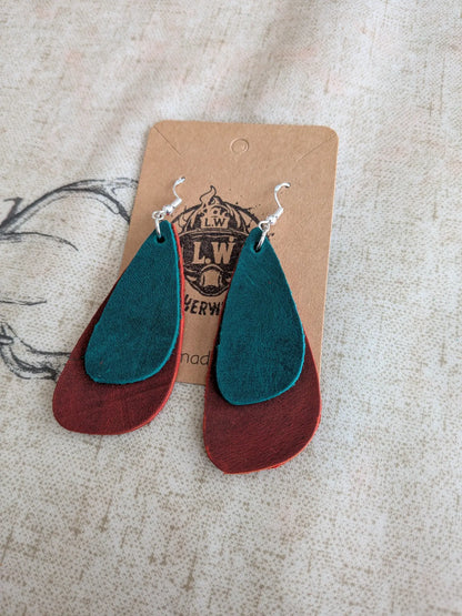 Teal and rust-colored layered leather earrings with silver hooks made from orange oregano leather for stylish wear