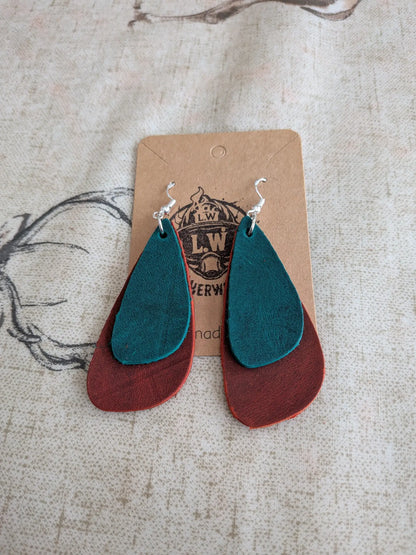 Teal and rust-colored layered orange oregano leather earrings with silver hooks in a drop leather earrings design