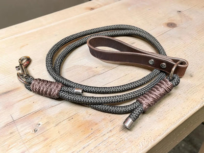 Dark gray braided rope full grain leather dog lead with brown leather handle and metallic hardware for durability