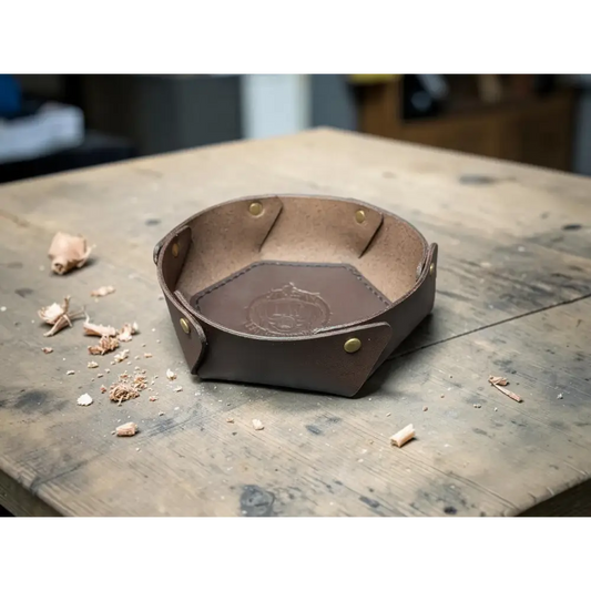 Handmade brown leather bowl with brass rivets and embossed logo made from vegetable-tanned full-grain leather