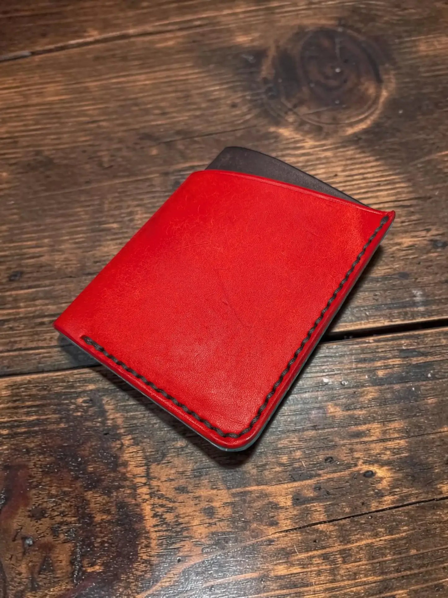 Kade card holder full grain leather wallet in red with dark stitching and black interior for organized card storage