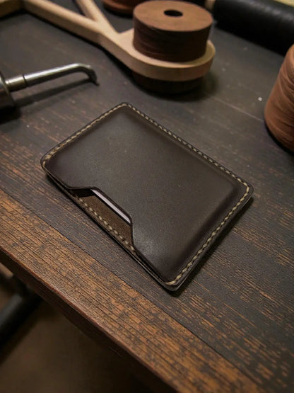 Dark brown handmade leather memphis card holder wallet with light stitching for minimalist card storage